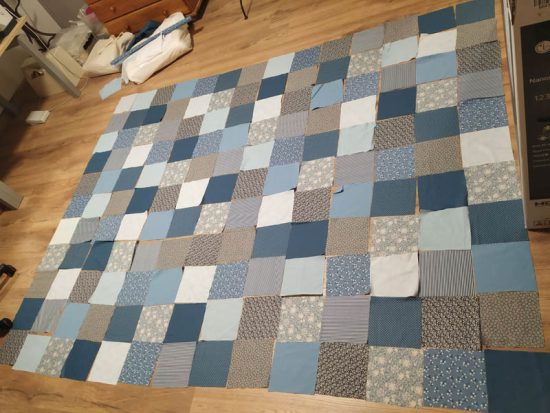 quarters of fabric on the floor