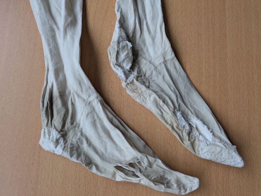 Worn medieval stockings